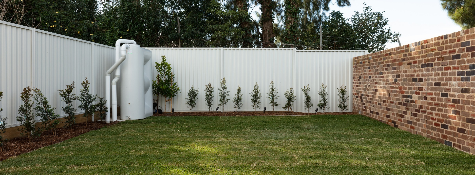 ZOOM-PRO outdoor spike lights positioned along a residential garden